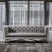 Regis Contemporary Sofa in Grey Fabric with Black Metal Finish Legs and Antique Brown Nailhead Accents - ARL2015
